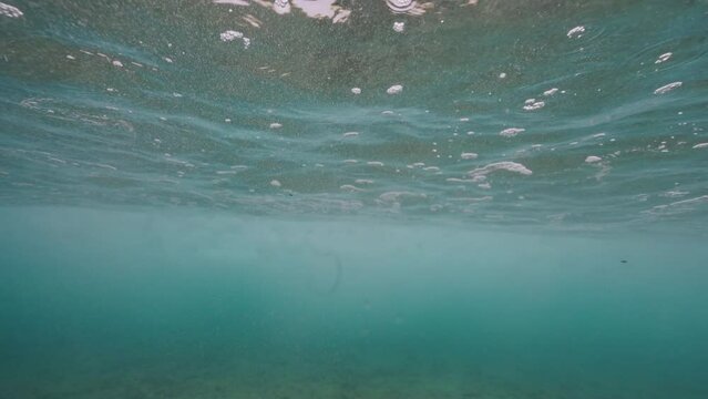 Slow motion underwater waves