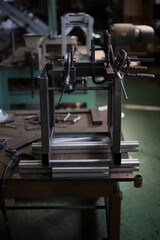 Work welding iron frames
