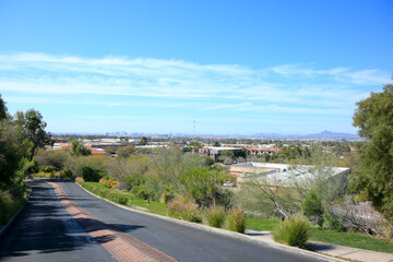 Arizona capital city of Phoenix downtown viewed above rooftops of south part of Valley of the Sun toward North mountains