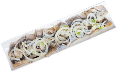 Appetizing raw herring with onion slices served on platter. Isolated over white background