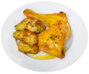 Grilled chicken with potatoes on side served on plate. Isolated over white background