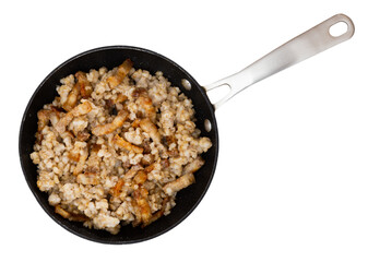 Appetizing pearl barley with slices of fried lard served on dish. Isolated over white background