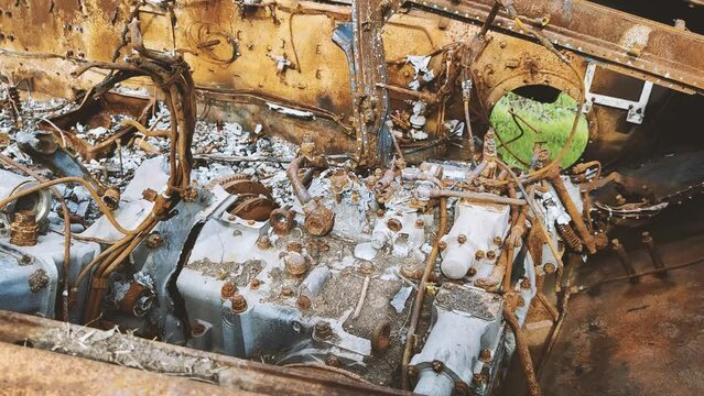 Russian tank or bmp destroyed by the Ukrainian military during the invasion of Ukraine. The remains of a blown up Russian tank in the Kherson region, Ukraine . The tank is covered with rust