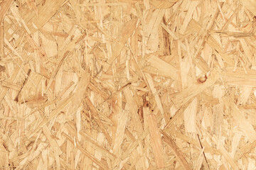 Bright contrasting background of chipboard rough texture yellow