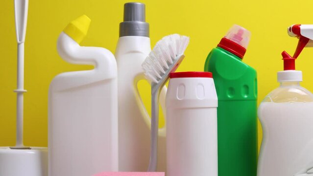 A set of different cleaning and disinfectant products on a coloured background