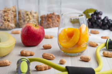 Fototapeta na wymiar healthy breakfast, peaches, banana, cashew nuts and almonds