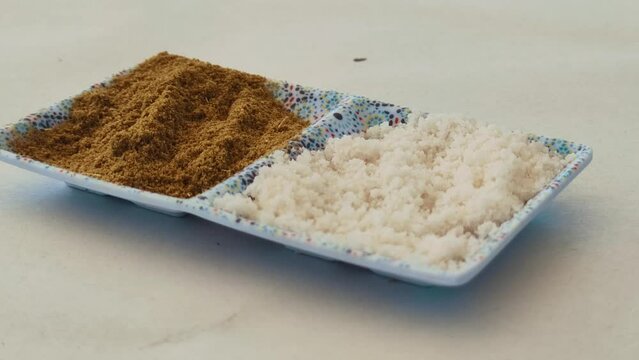 Close up of Salt and Cumin in a moroccan table