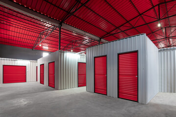 Corridor of self storage unit with red doors. Rental Storage Units