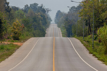 Countryside road up and down on hilly with bad visibility, Smog or dust PM 2.5 (Particulate matter...