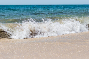 Waves crashing into land