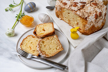 Italian Easter colomba cake with almonds and candied fruits and Easter eggs  and holiday decorations easter bunny