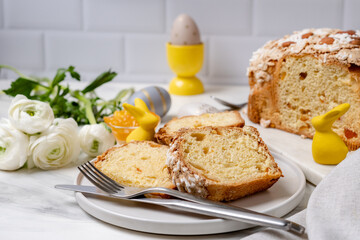 Italian Easter colomba cake with almonds and candied fruits and Easter eggs  and holiday...