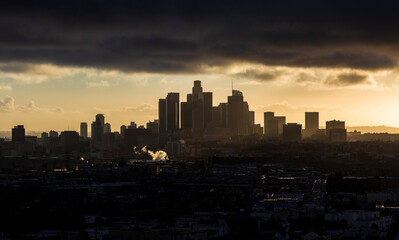 Moody Downtown Los Angeles at Golden Hour with Light shinning trough the clouds