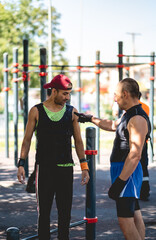 Urban fitness connection: elderly instructor inspiring younger generation in street workout park
