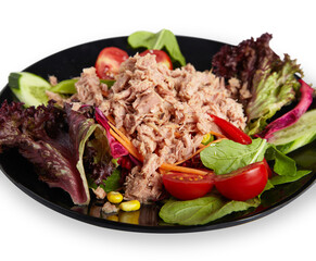 Tuna Salad on Black Plate Isolated White Background Close Up