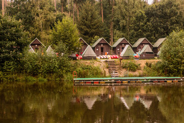 Fototapeta na wymiar Huts at a camping place near Luznice river, Czech Republic