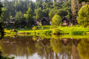 Fototapeta na wymiar Huts by Luznice river, Czech Republic