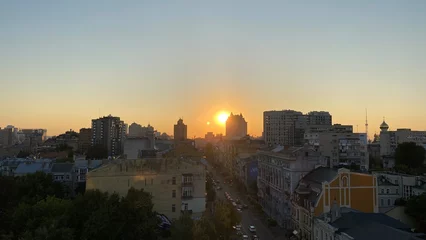 Fotobehang sunset over the city © Юрий Боровик