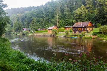 Obraz premium Rural holiday cabins along Luznice river, Czech Republic