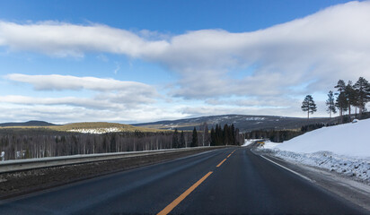 Winter country road to Trondheim, Norway. View from car driver
