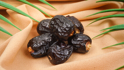 Ajwa al madina natural dates from Saudi. Dates fruits on napkin