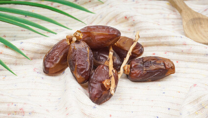 Pile of tasty dry dates or Kurma on napkin. selective focus