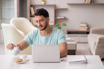 Young male freelancer working from home