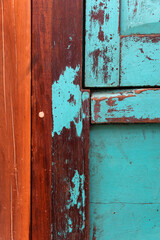 Old grungy wooden faded door texture. Abstract vertical background