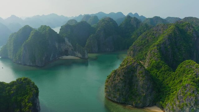 Aerial view of scattered islands with inlets and coves at Ba Trai Dao archipelagos and island cluster, Haiphong, Vietnam.