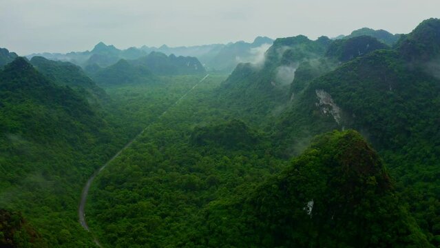 Aerial view of mountain landscape with low clouds and fog in Haiphong state, Vietnam.