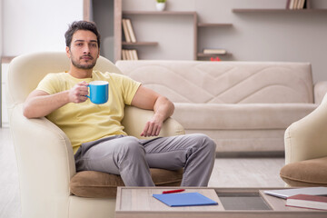 Young man working from home during pandemic