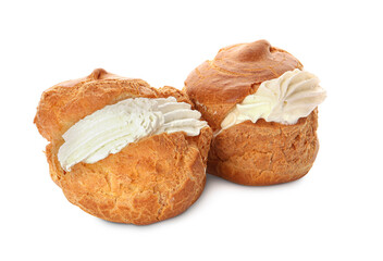 Delicious profiteroles with cream filling on white background
