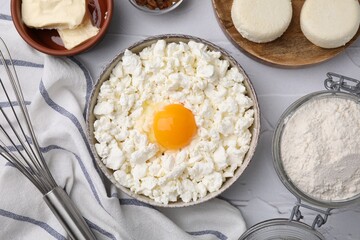 Different ingredients on white textured table, flat lay. Cooking cottage cheese pancakes