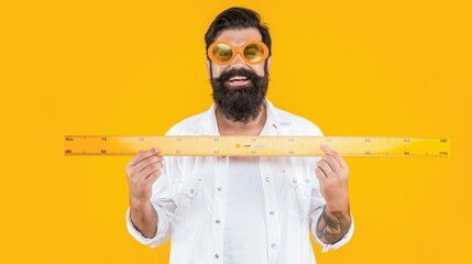 happy school man measure with ruler in studio. school man measure with ruler
