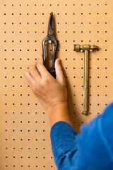 hand tools on a workshop peg board.