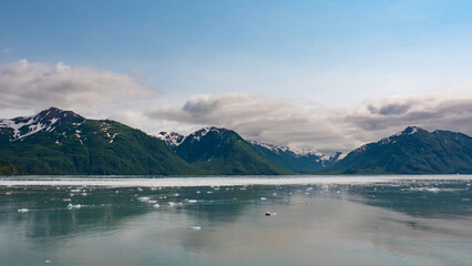 Naklejka na ściany i meble Mountain coast natural seascape. Hubbard Glacier nature in Alaska, USA. Scenic view