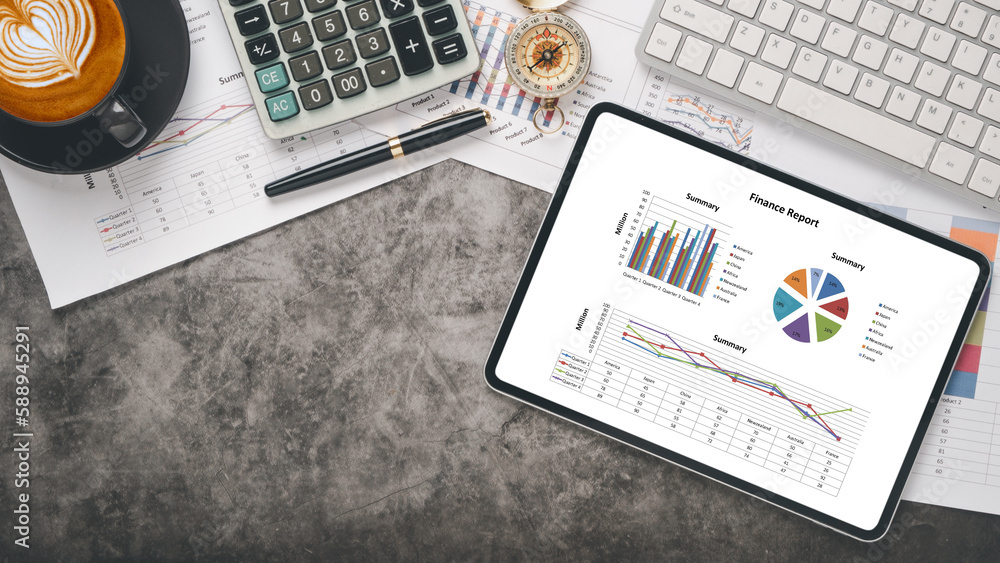 Aufkleber tablet with charts and reports on office desk workplace. top view flat lay..