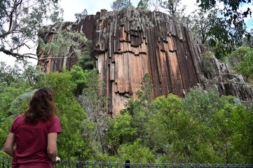 Woman looking at the magnificent Sawn Rocks New South Walse Australia