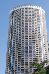 Obraz premium high skyscraper architecture on blue sky, vertical photo. skyscraper architecture outdoor.