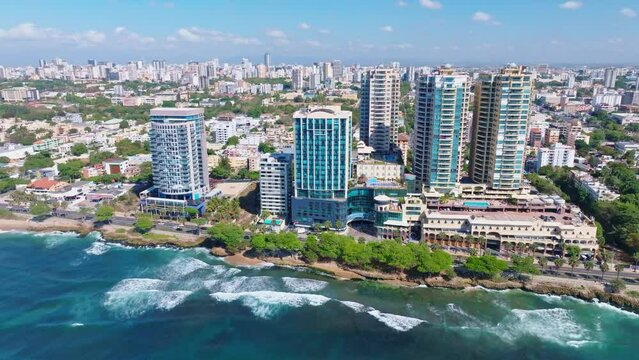 Waterfront High-Rise Buildings At Santo Domingo Malecon In Avenida George Washington, Dominican Republic. Aerial Drone Shot