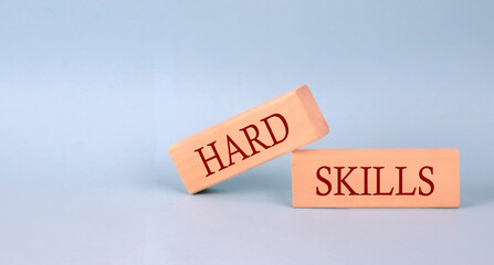 HARD SKILLS text on the wooden block, blue background