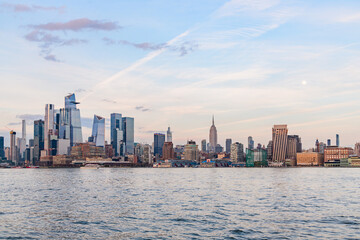 Naklejka premium Midtown NYC and Hudson Yards Sunset with Moon from Hoboken NJ