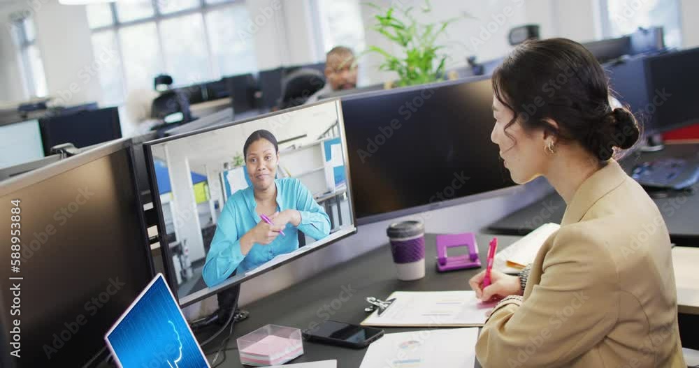 Poster asian businesswoman in office using computer with video call and ai messaging on screens