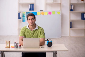 Young male designer sitting in the office