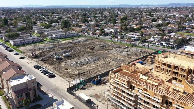 Afternoon aerial view of demolition and new construction in downtown Watts, California, USA.
