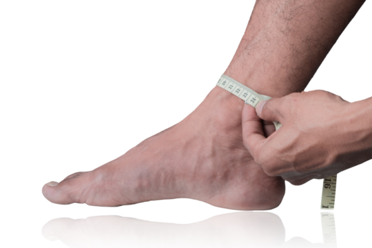 Close-up of a man measuring foot size with a measuring tape on a clipping path white background