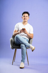 image of asian boy posing on purple background