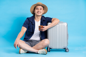 travel asian man portrait, isolated on blue background