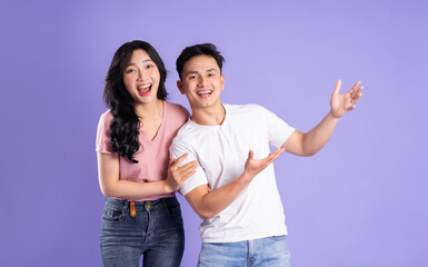 image of asian couple posing on purple background