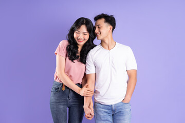 image of asian couple posing on purple background